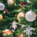 tilt shift photography of green christmas tree with baubles