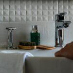 a person holding the white sink