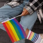 close up photo of pride flag held by a person